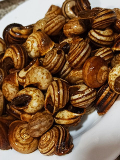 Una foto de Caracoles fritos al ron