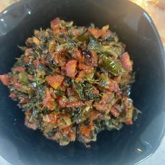 A picture of Fenugreek leaves with carrot 🥕.