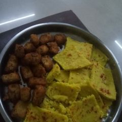 A picture of Dhokla and cheese potato bites.