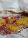 Branzino al cartoccio con erbe aromatiche, arancia e melagrana