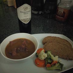 A picture of Dad's Ox Tongue, Steamed Veggies and Rye Bread.