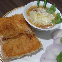 A picture of Cheesy buttery bhaaji with masala pav.