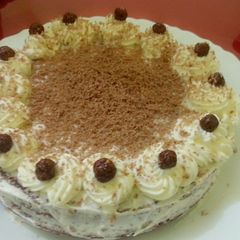 A picture of Chocolate cake with whipping cream.