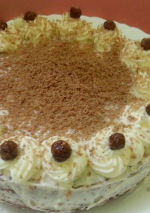 A picture of Chocolate cake with whipping cream.