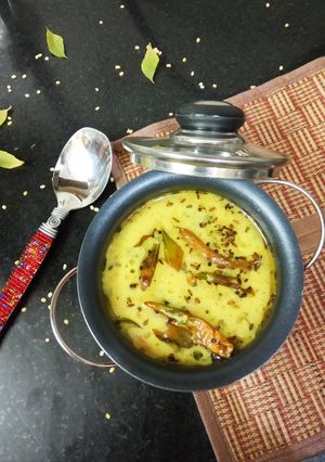 A picture of Hesarubele Bili Saru/Moong dal tomato rasam.