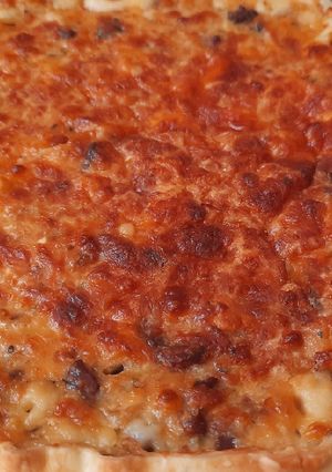 Una foto de Tarta de panceta, cebolla y queso