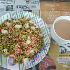 A picture of Moong chaat with a cup of tea.