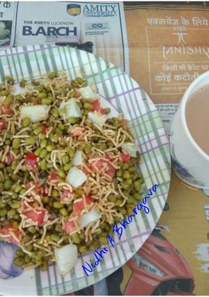 A picture of Moong chaat with a cup of tea.