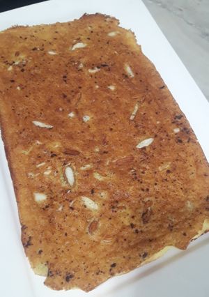 Una foto de Torta de naranja y coco con chisp de chocolate