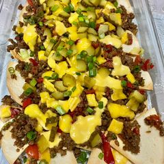 A picture of Ground meat nachos.