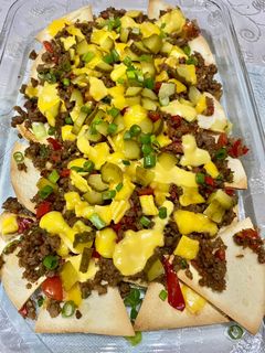 A picture of Ground meat nachos.