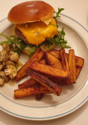 A picture of Burger with triple cooked chips.