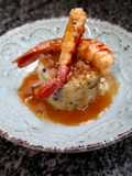 Trinxat con butifarra negra, panceta y gambas