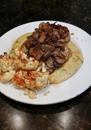 A picture of Brad's eye of round steak over jalapeño cheddar polenta.