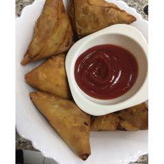 A picture of Chicken cheese Samosa.