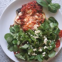 Baked zucchini with salad A picture of Baked zucchini with salad.