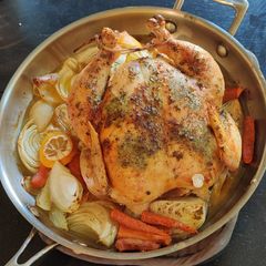 A picture of Herb Roasted Chicken with Gravy.