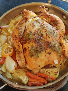A picture of Herb Roasted Chicken with Gravy.