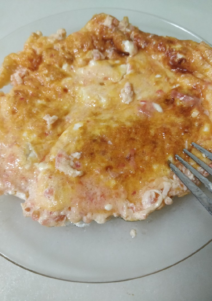 Una foto de Tortilla con tomate y queso
