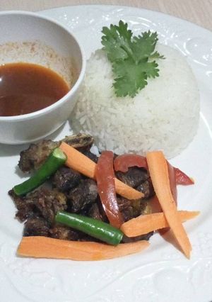 A picture of Fried beef with rice.