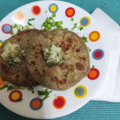 A picture of Mini Bajra paratha stuffed with fresh matar methi leaves.