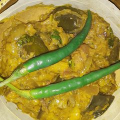 A picture of Achari palak baigun.