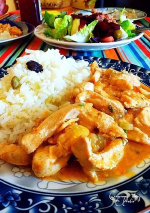 Una foto de Tiras de pollo al curry tikka en salsa de leche de coco