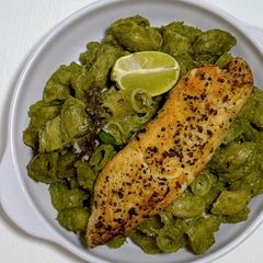 A picture of Creamy Cilantro and Thai Basil Pesto Macaroni with Lemon Pepper Fish Fillet.