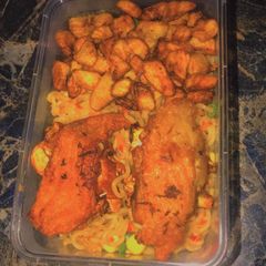 A picture of Stir fry noodles with turkey and fried plantain.