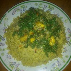 A picture of Curry rice and plantain veggie sauce.
