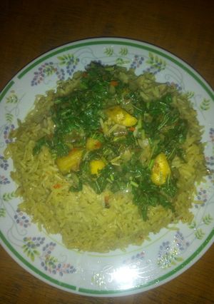 A picture of Curry rice and plantain veggie sauce.