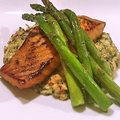 Salmon with Tuscan creamed spinach and asparagus A picture of Salmon with Tuscan creamed spinach and asparagus.