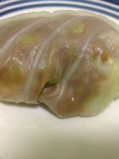 A picture of Baked Cabbage Rolls in White Sauce.