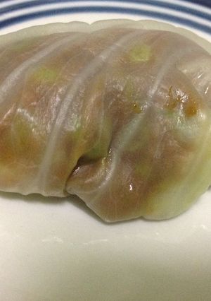 A picture of Baked Cabbage Rolls in White Sauce.