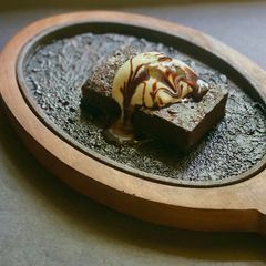 A picture of Sizzling Brownie with Ice Cream.