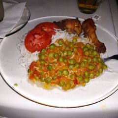Boiled Rice Coconut green pease and Fried Chicken A picture of Boiled Rice Coconut green pease and Fried Chicken.