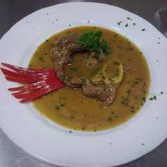 Una foto de Ossobuco al vino blanco