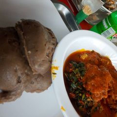 A picture of Amala and fresh fish vegetable stew.