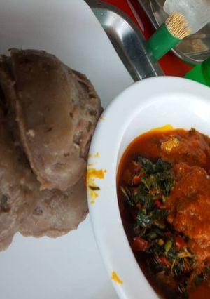 A picture of Amala and fresh fish vegetable stew.