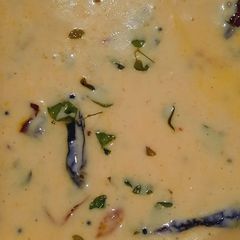 A picture of Moringa leaves in curd curry.