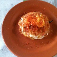 Fried egg made in an iron wok A picture of Fried egg made in an iron wok.
