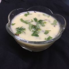 A picture of “Gujarati Kadhi” or “Gujarati Curry”.
