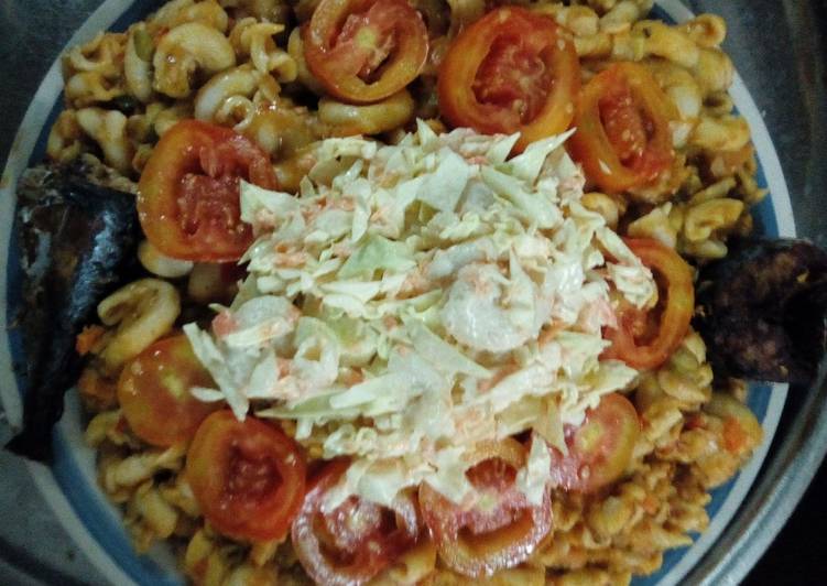 Macaroni,washed beans with salad, tomatoes and fish