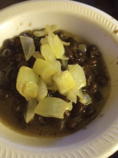 A picture of Black Beans with Vinegar-Butter, Poached Onion.