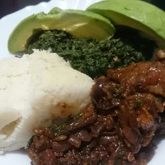 Ugali kienyeji and chicken+ guacamole 😋 A picture of Ugali kienyeji and chicken+ guacamole 😋.