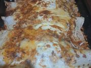 Una foto de canelones de ricota y jamón