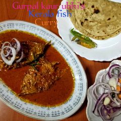 A picture of Kerala fish curry 🐠🥥🍅🧄.