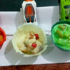 A picture of Tricolor fruit custard tricolor chocolate bowl.