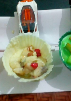 A picture of Tricolor fruit custard tricolor chocolate bowl.