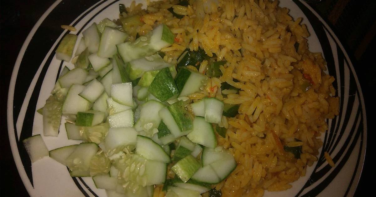 Jollof rice garnish with cucumber Recipe by Bernice Dakwal Cookpad